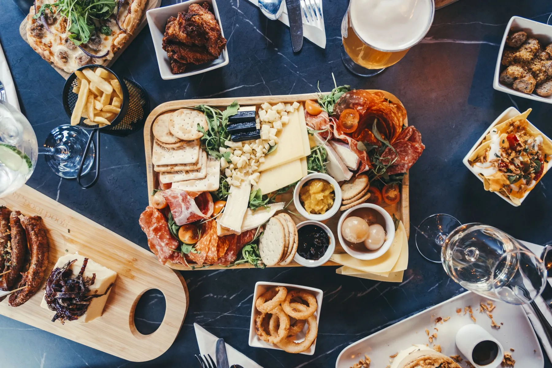 The charcuterie board with cold meats, cheese and crackers